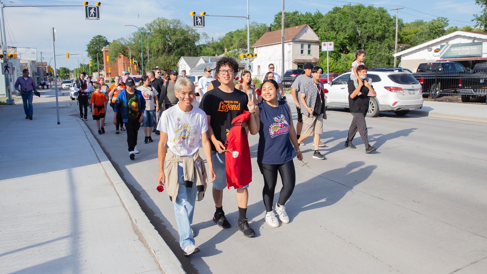 While graduates marched down Salter Street with proud family and friends, the Winnipeg Police Service chaperoned the parade-goers safely down the street.